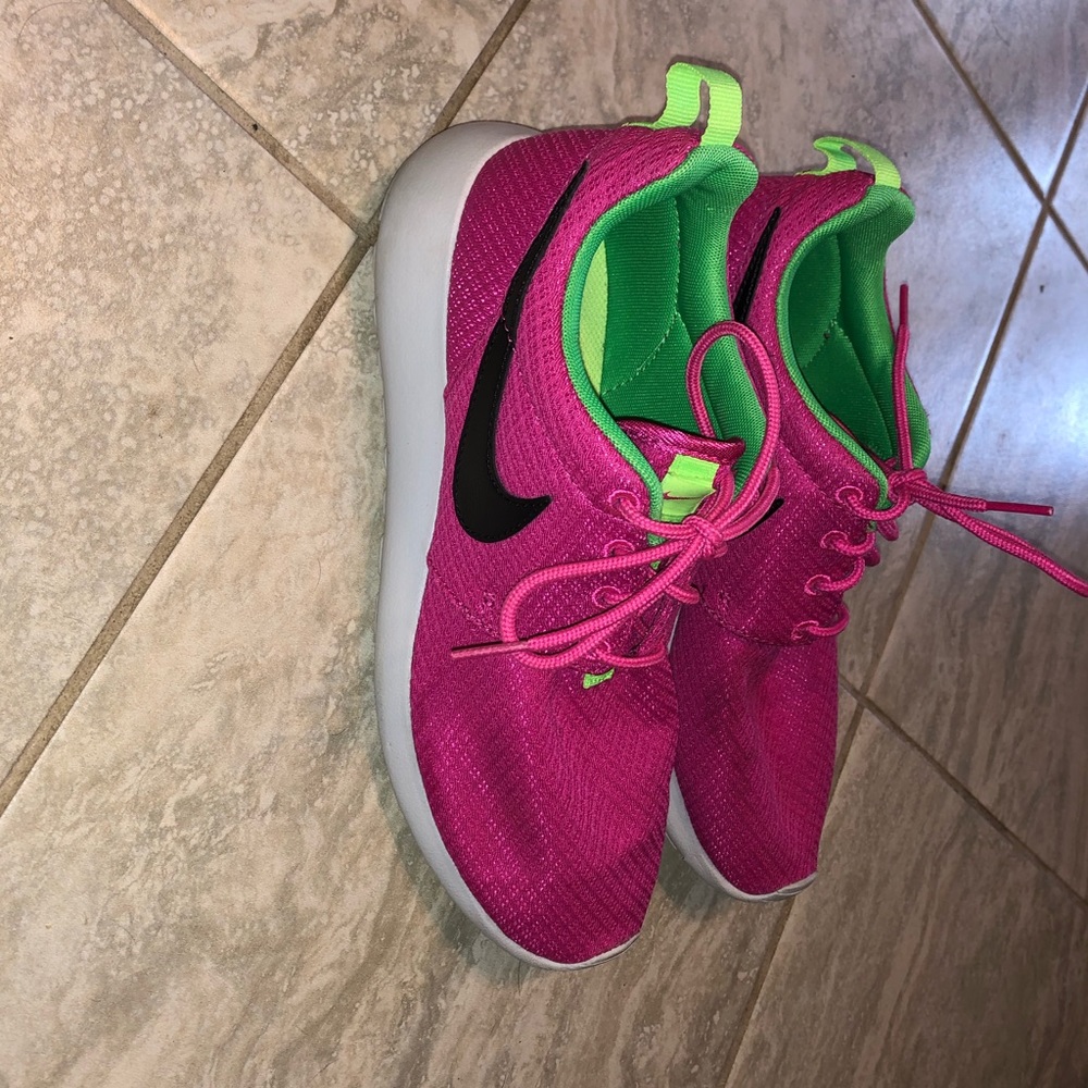 Pink and green Nike Roshe